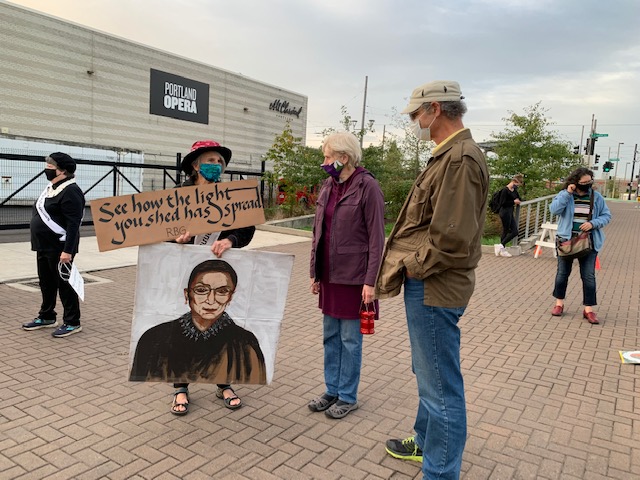 Speaking with attendees who joined the vigil.